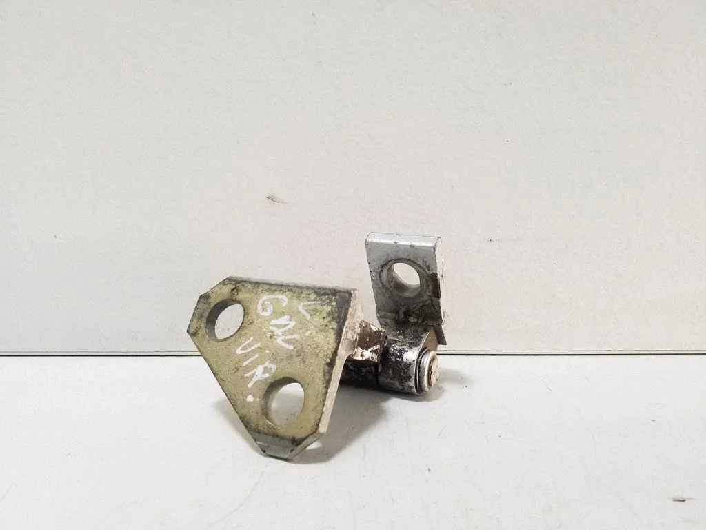 Rear door upper hinge – left