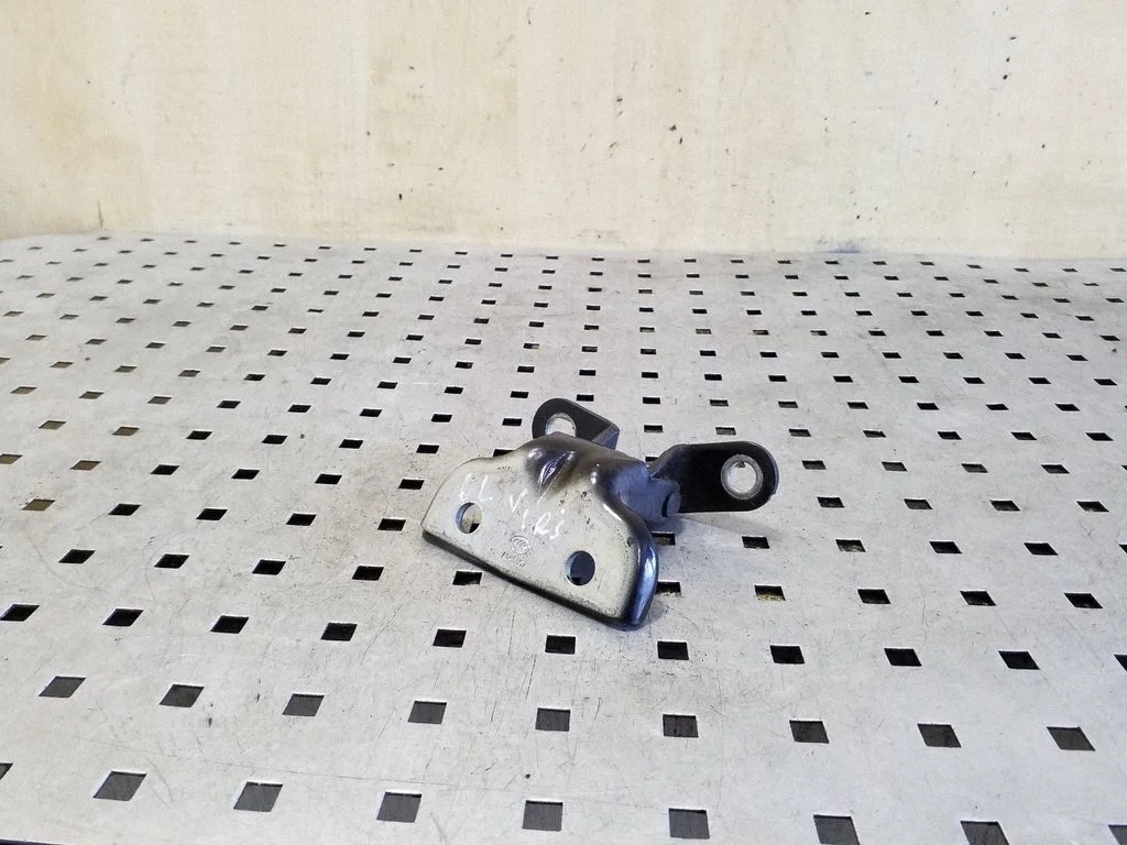 Rear door upper hinge – left