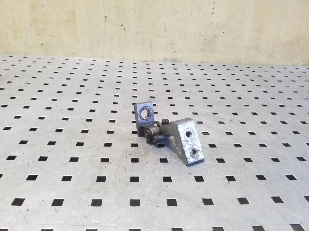 Rear door upper hinge – right