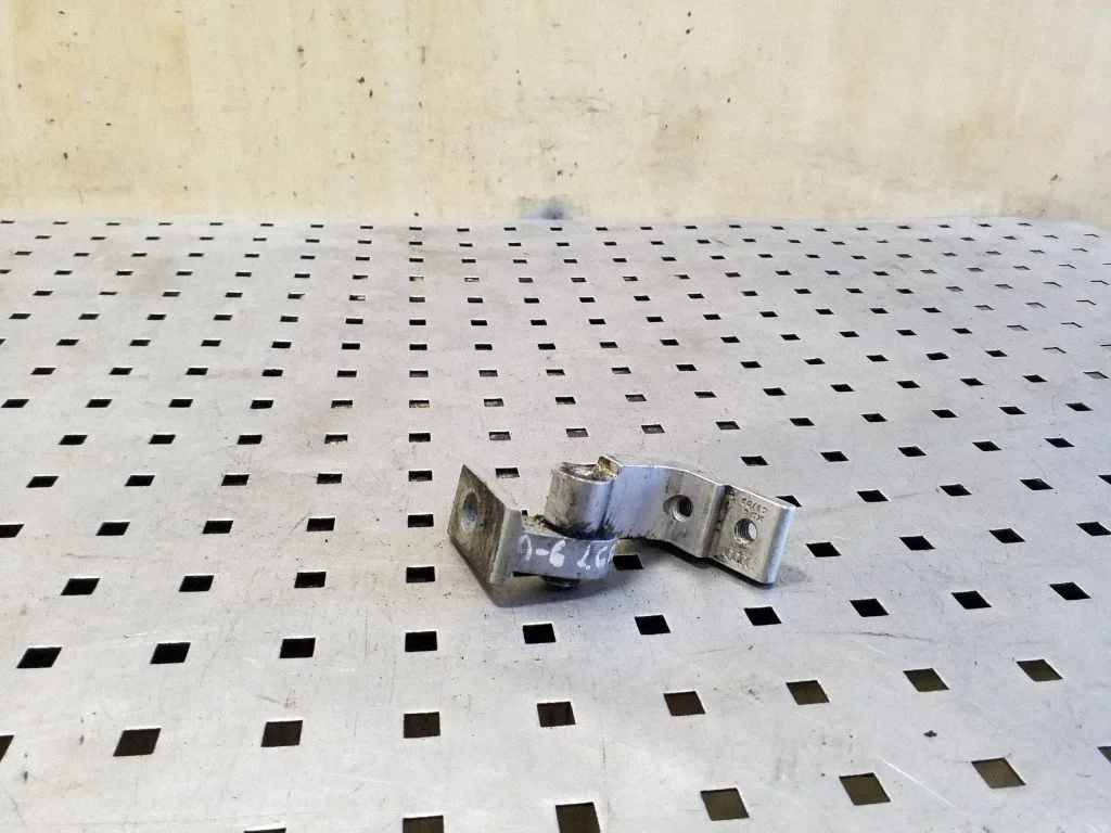 Rear door upper hinge – left