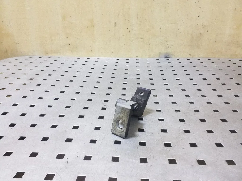 Rear door upper hinge – left