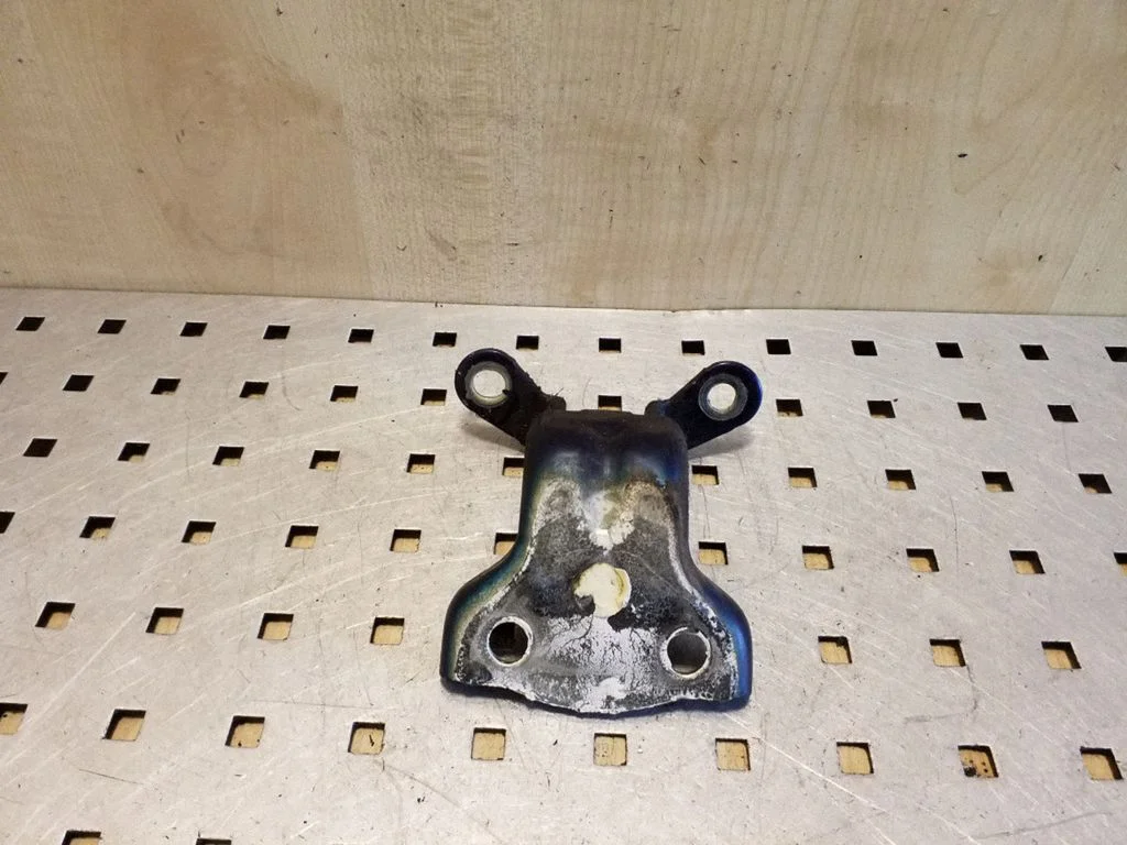 Rear door upper hinge – left