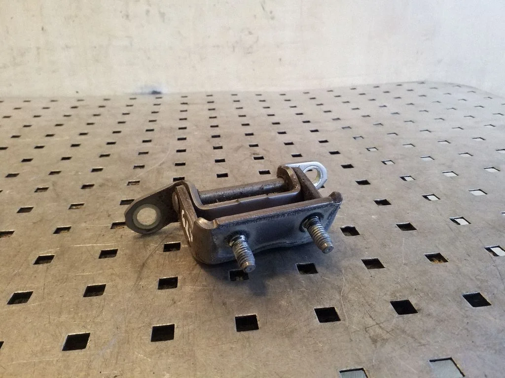 Rear door upper hinge – left
