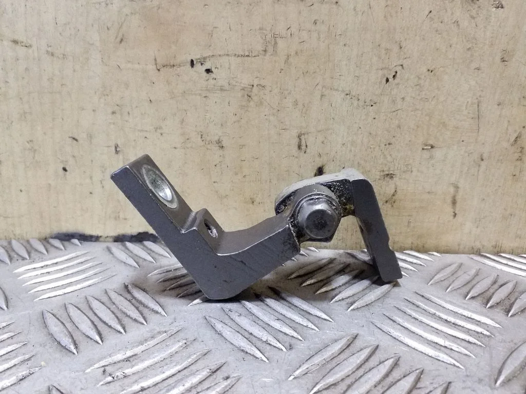 Rear door upper hinge – left