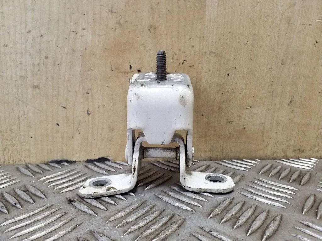 Rear door upper hinge – left
