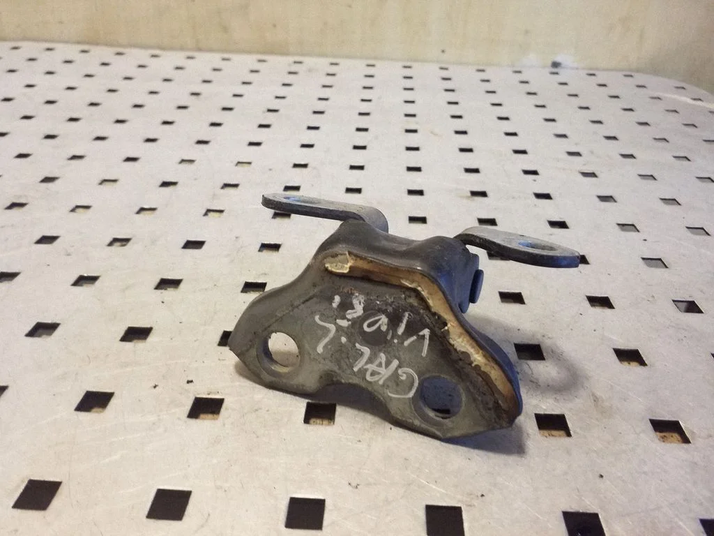 Rear door upper hinge – left