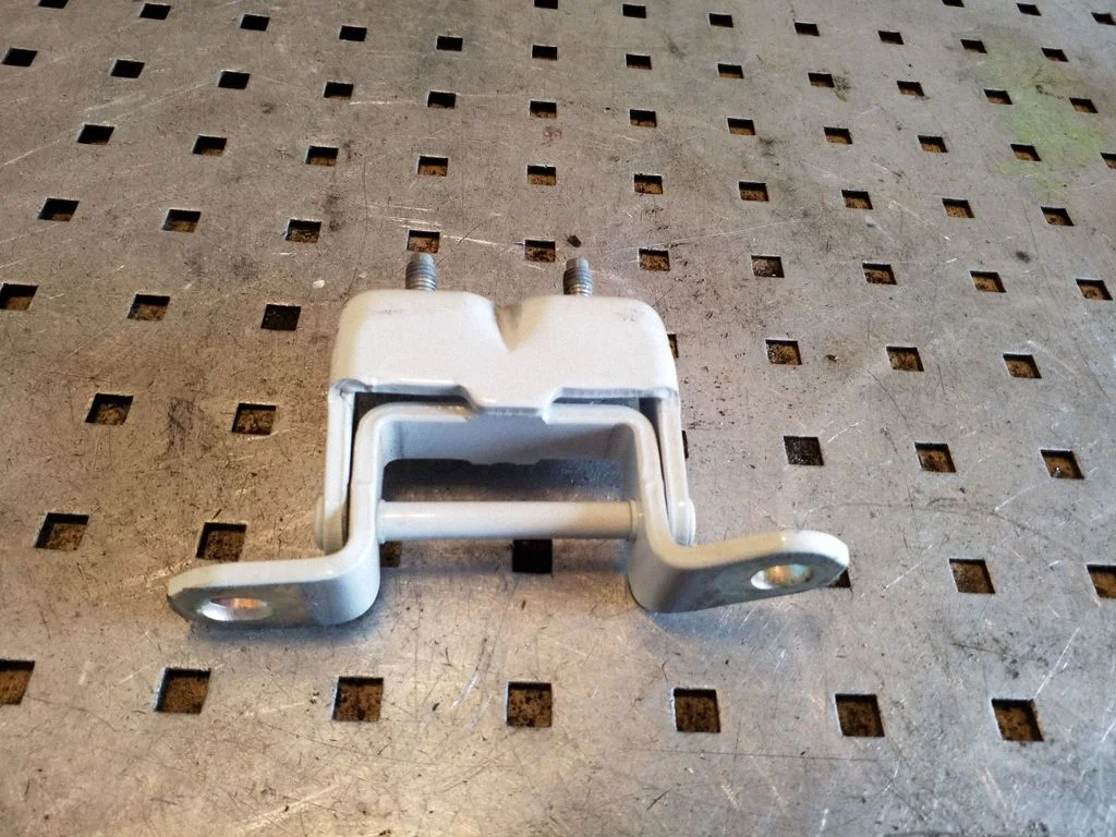 Rear door upper hinge – right