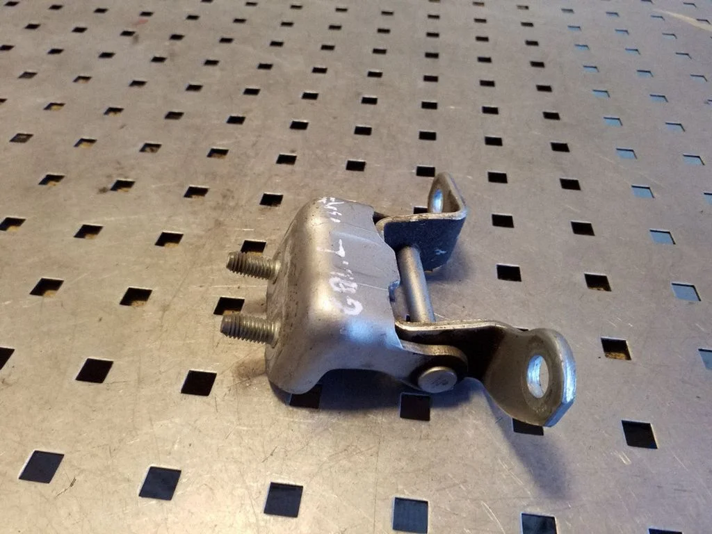 Rear door upper hinge – left