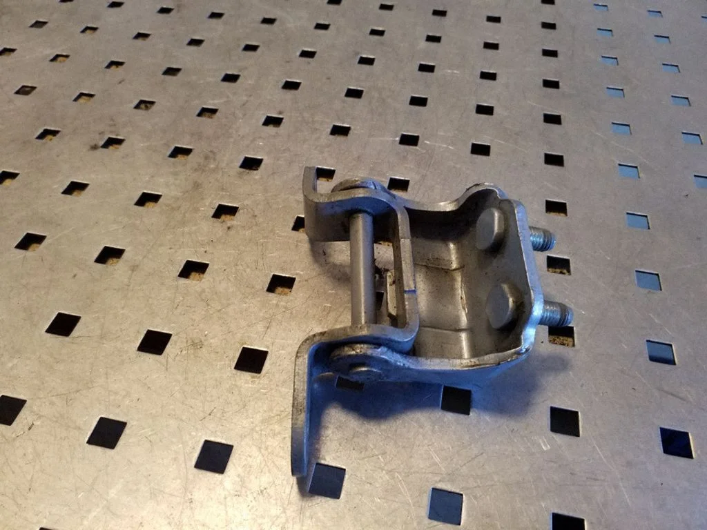 Rear door upper hinge – right