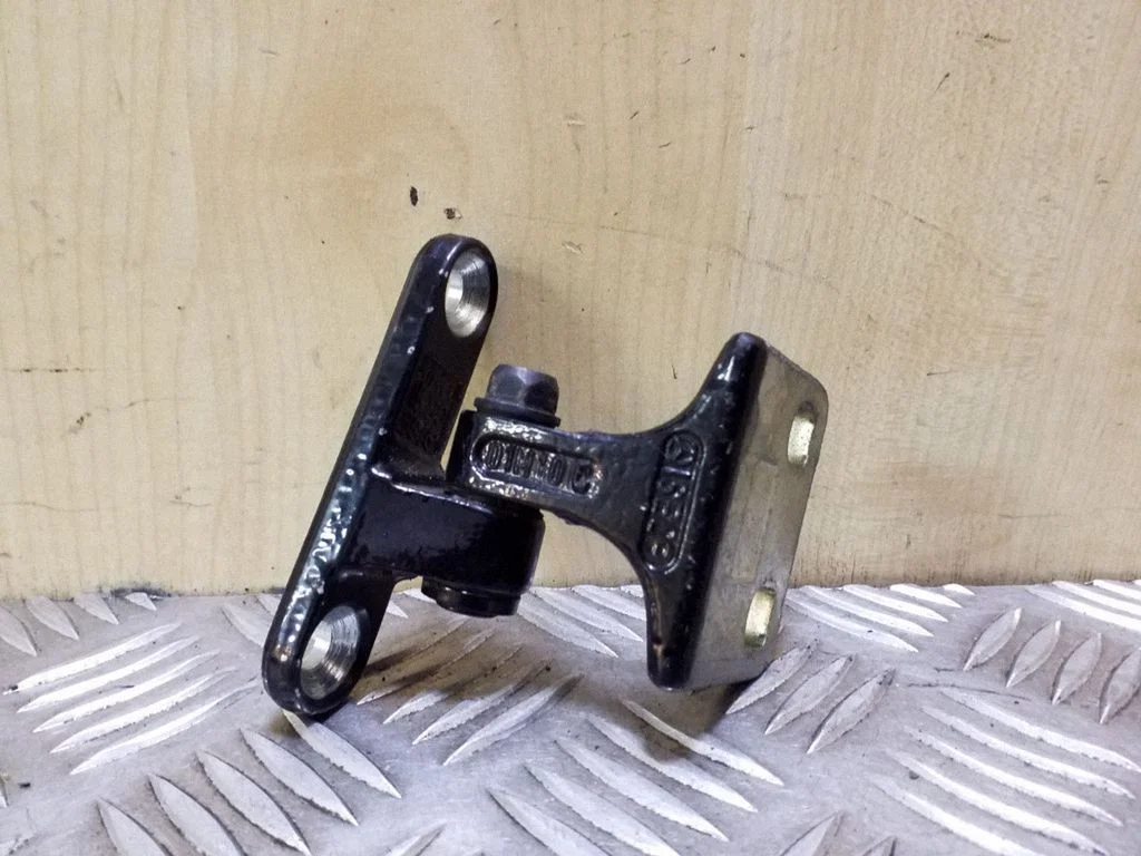 Rear door upper hinge – right