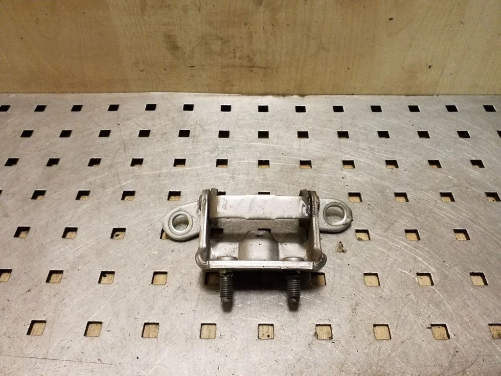 Rear door upper hinge – left