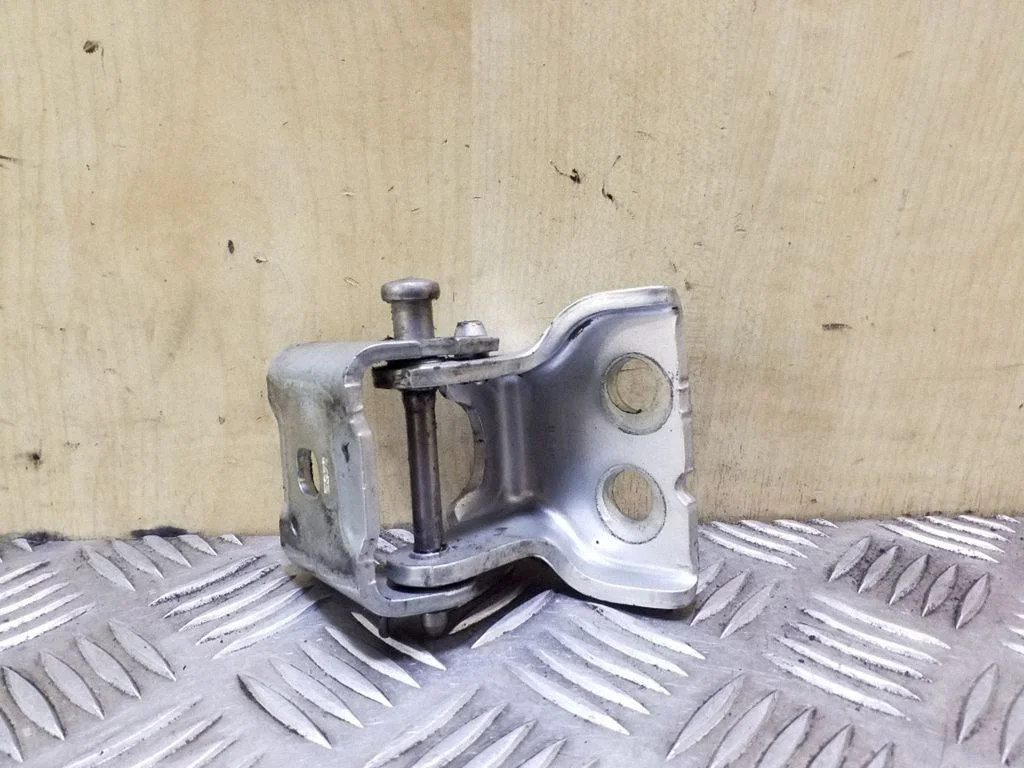 Rear door upper hinge – left