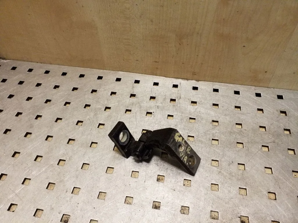 Rear door upper hinge – right