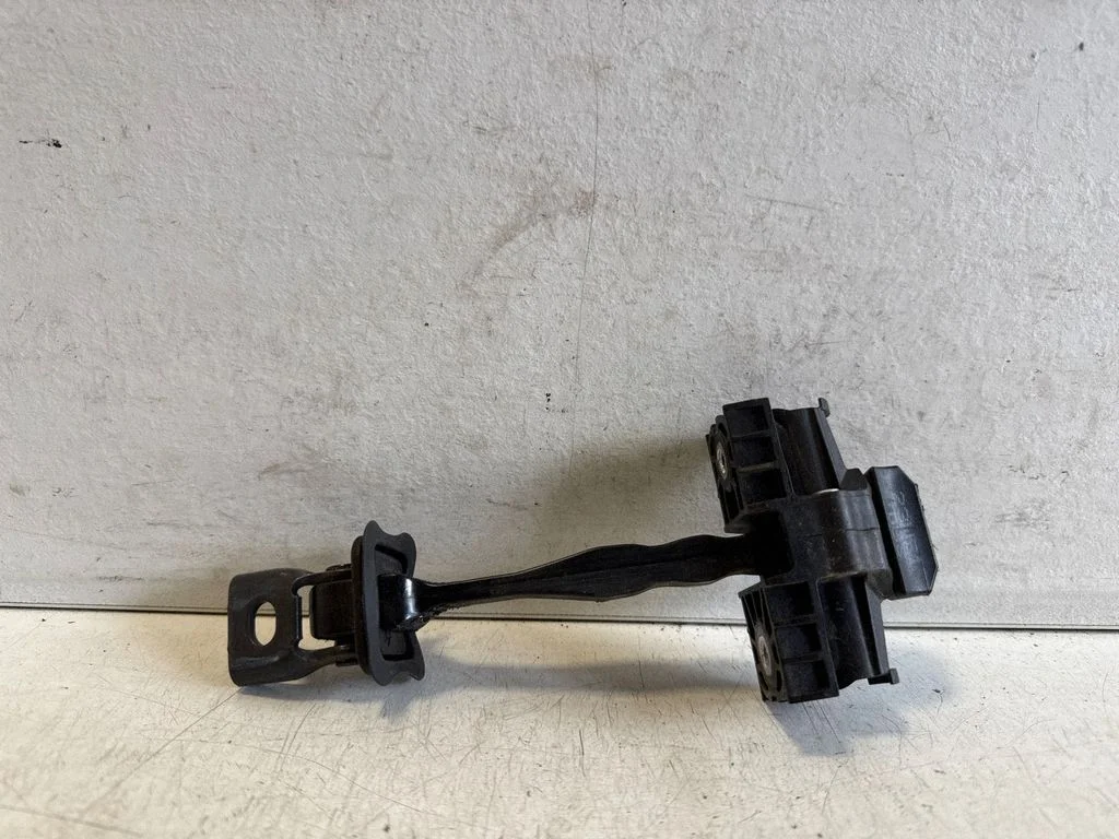 Rear door check strap stopper – rear right