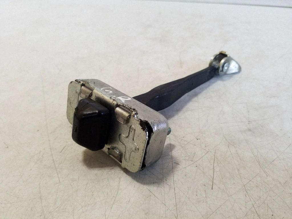 Rear door check strap stopper – right