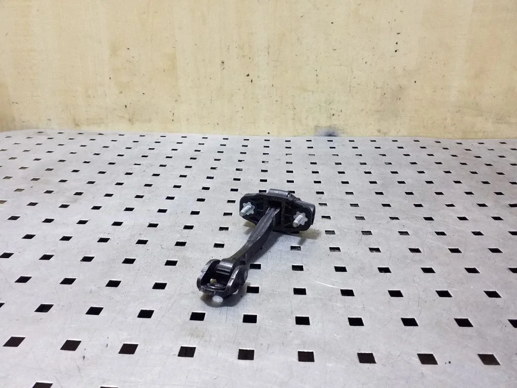 Rear door check strap stopper 31298427