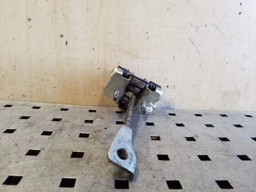 Rear door check strap stopper 02559R