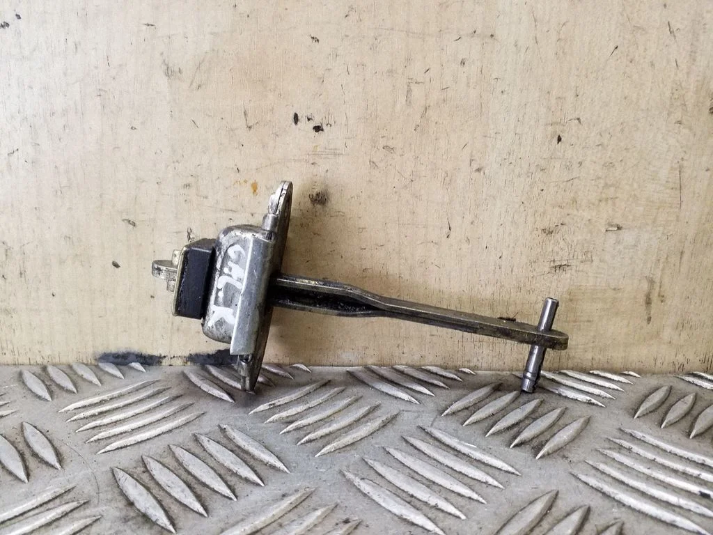 Rear door check strap stopper – right