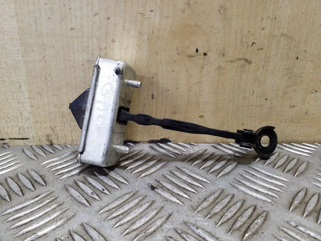 Rear door check strap stopper – rear right