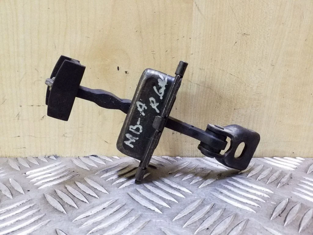 Rear door check strap stopper – right