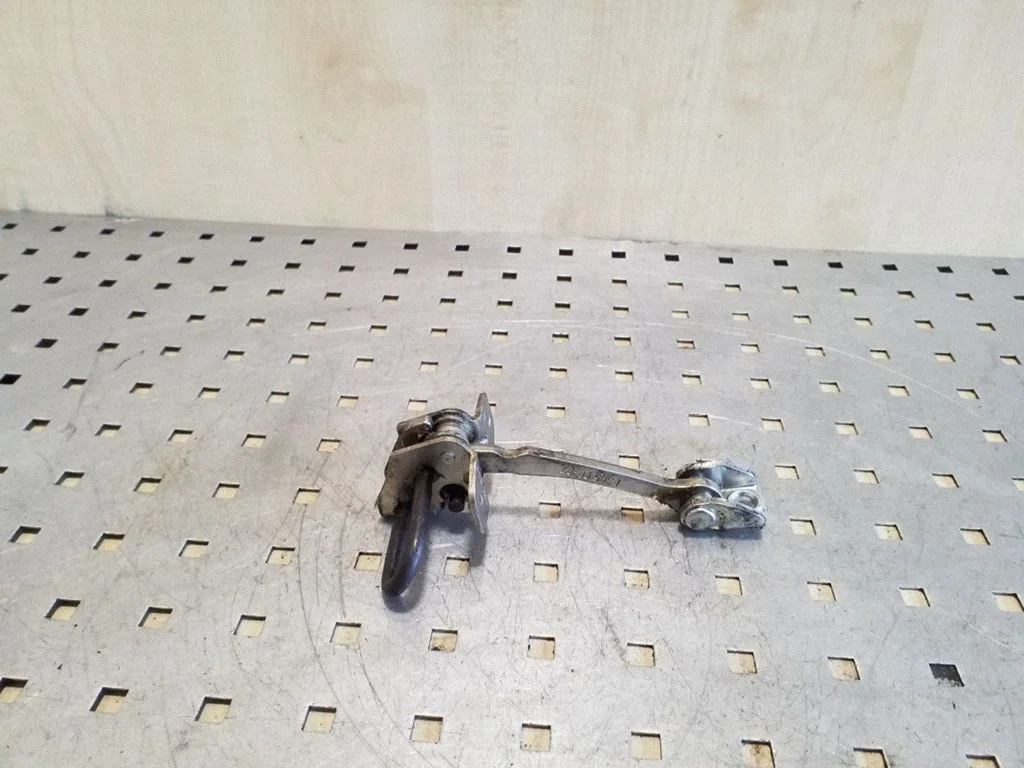 Rear door check strap stopper 13186209