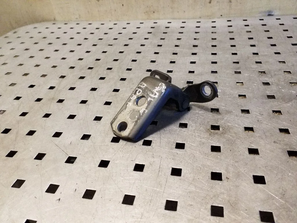 Rear door lower hinge – right