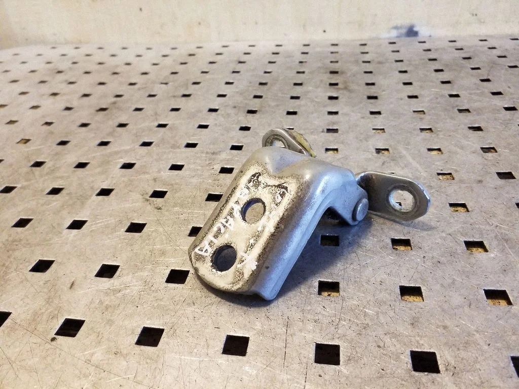 Rear door lower hinge – right