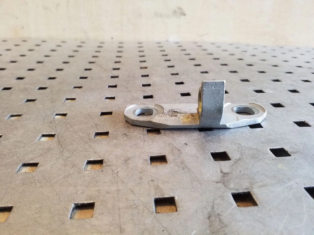 Rear door lower hinge – rear left