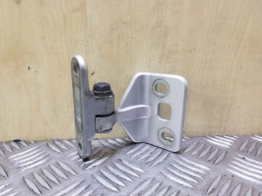 Rear door lower hinge – right