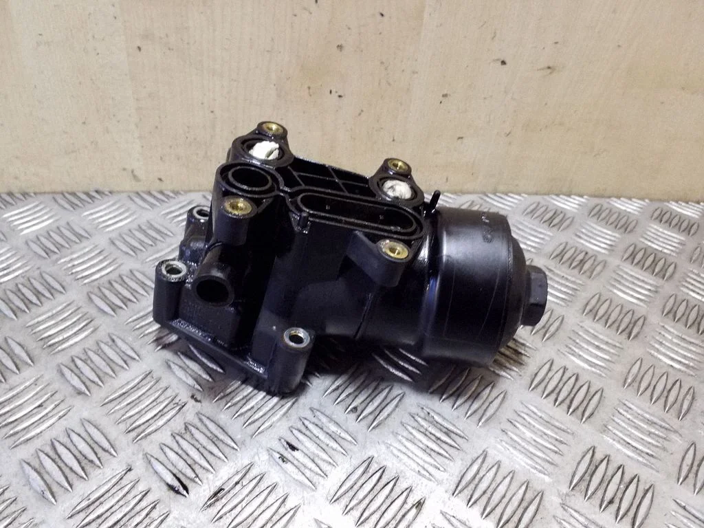 Oil filter mounting bracket 03L115389C