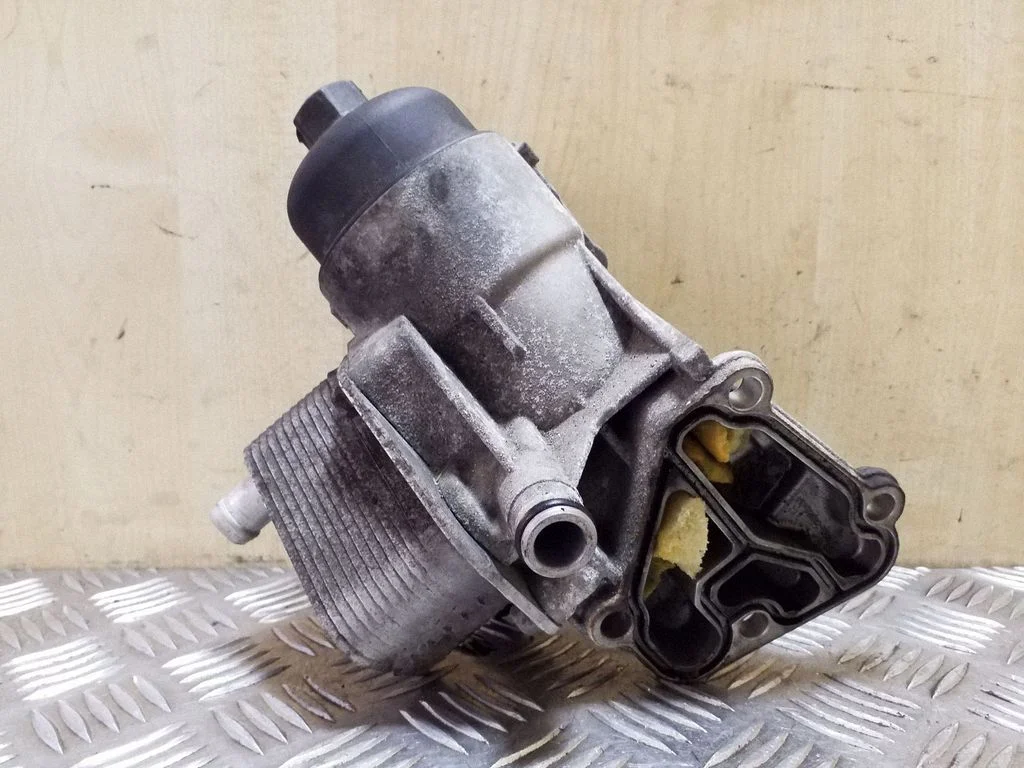 Oil filter mounting bracket 264102A501