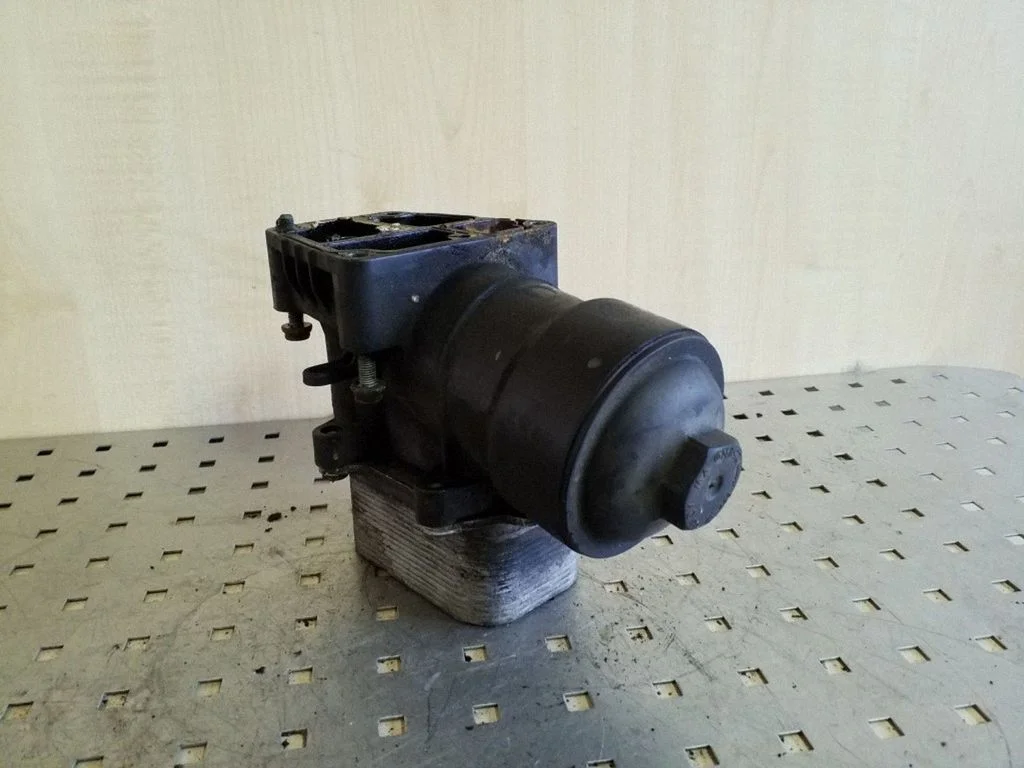 Oil filter mounting bracket 03L15389C