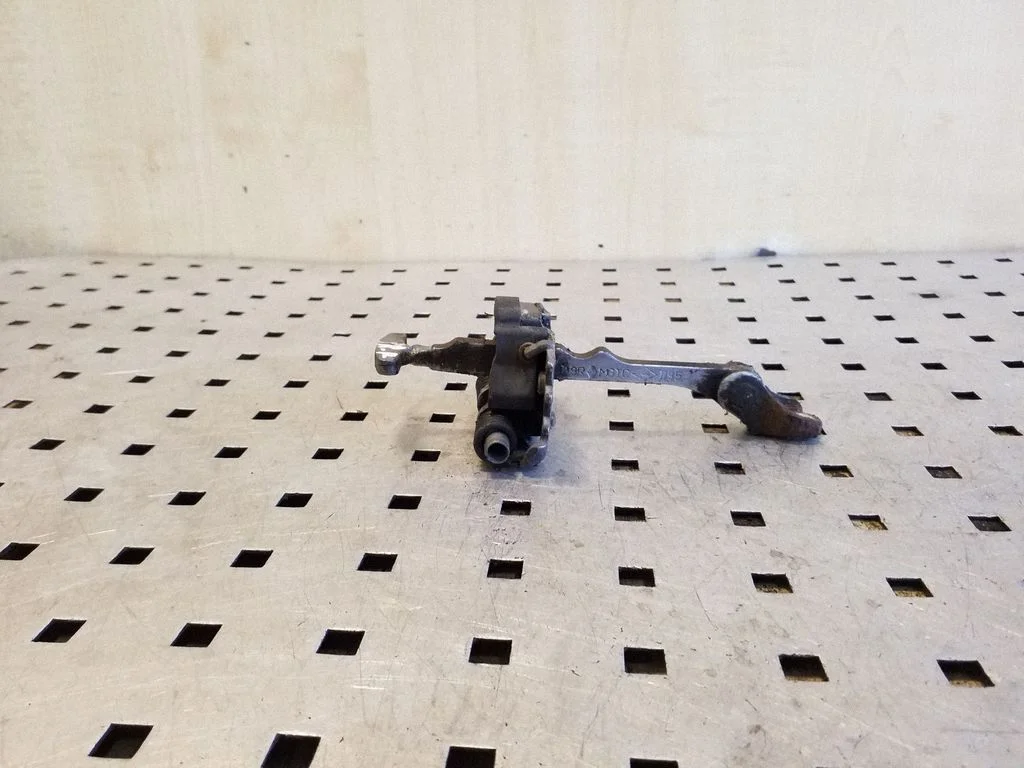 Front door check strap stopper – front right