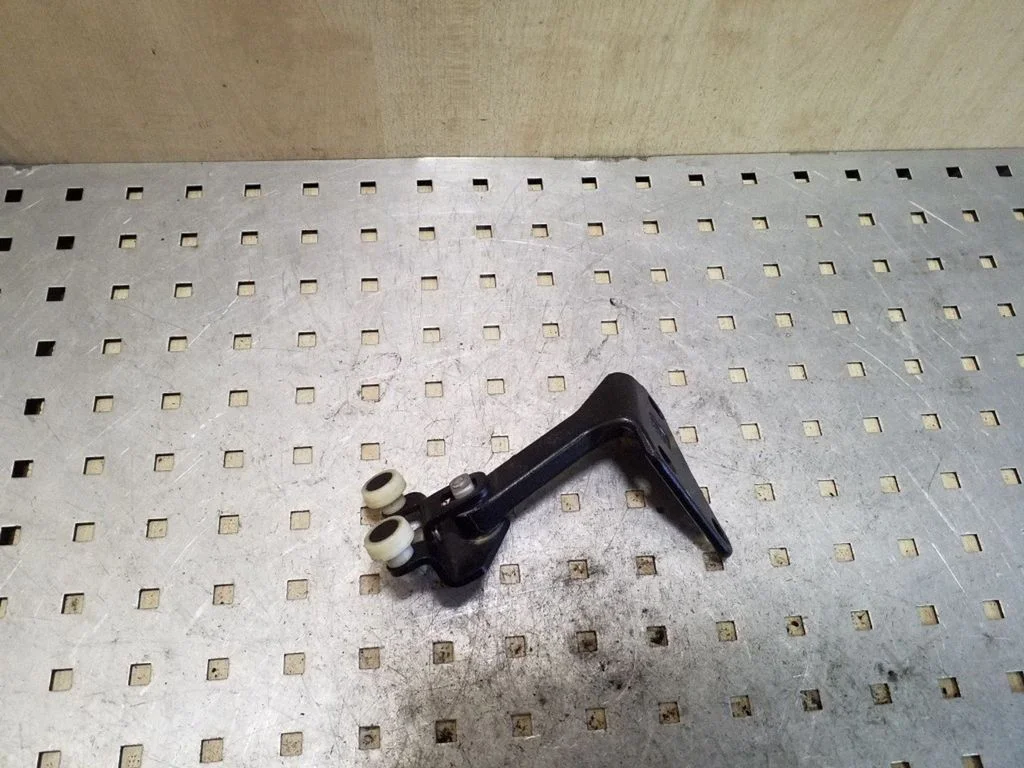 Sliding door upper roller guide/hinge
