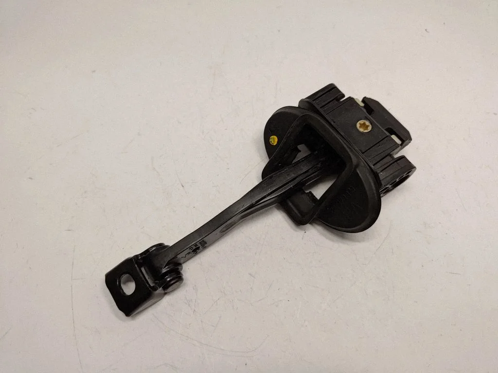 Front door check strap stopper 7335907