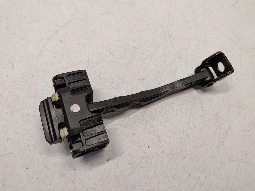 Front door check strap stopper 7182005