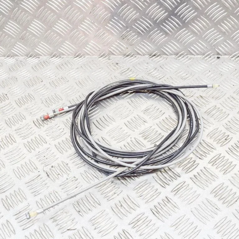 Fuel cap flap release cable