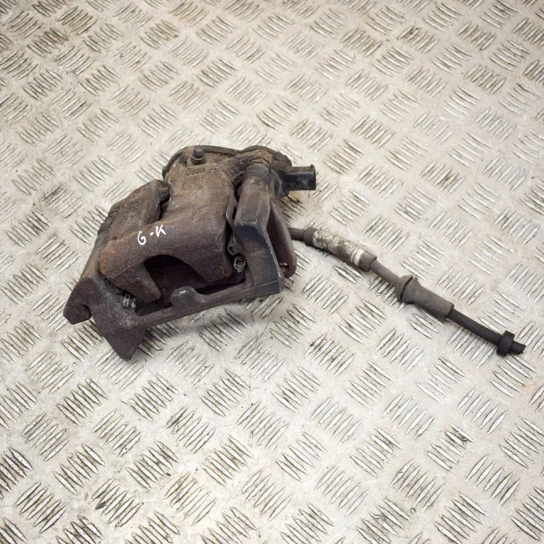 Rear brake caliper – left