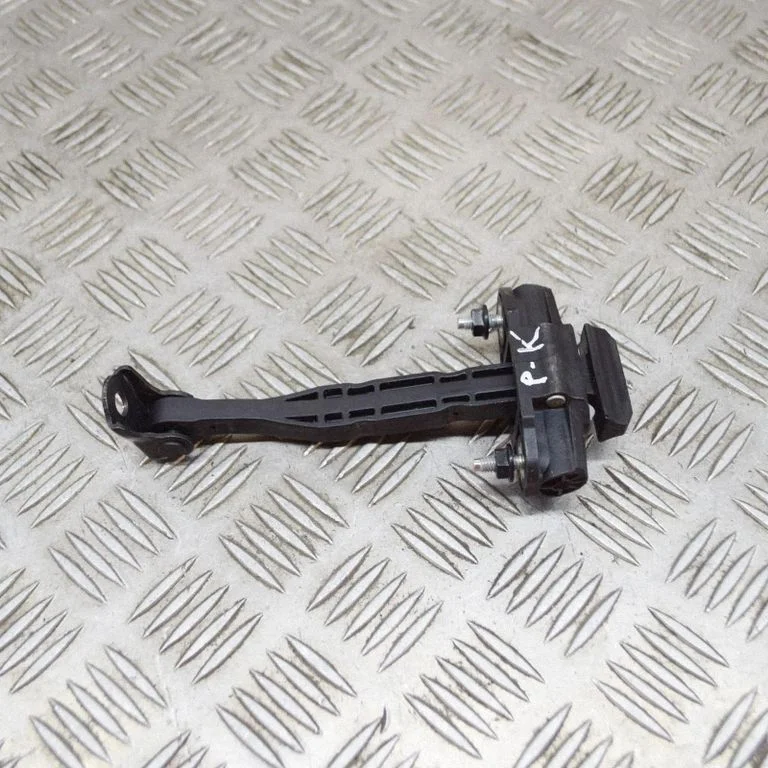 Front door check strap stopper – Tesla Model Y (2020-)