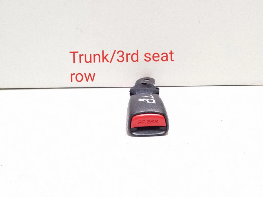 Rear seatbelt buckle – left