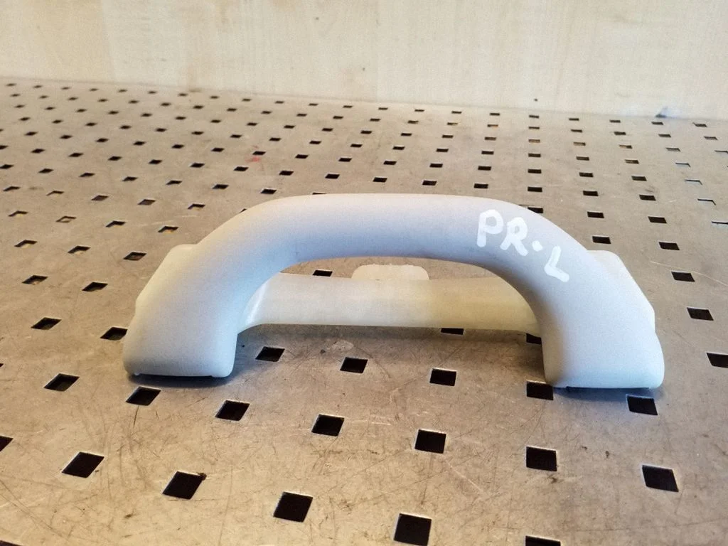 Front interior roof grab handle – left