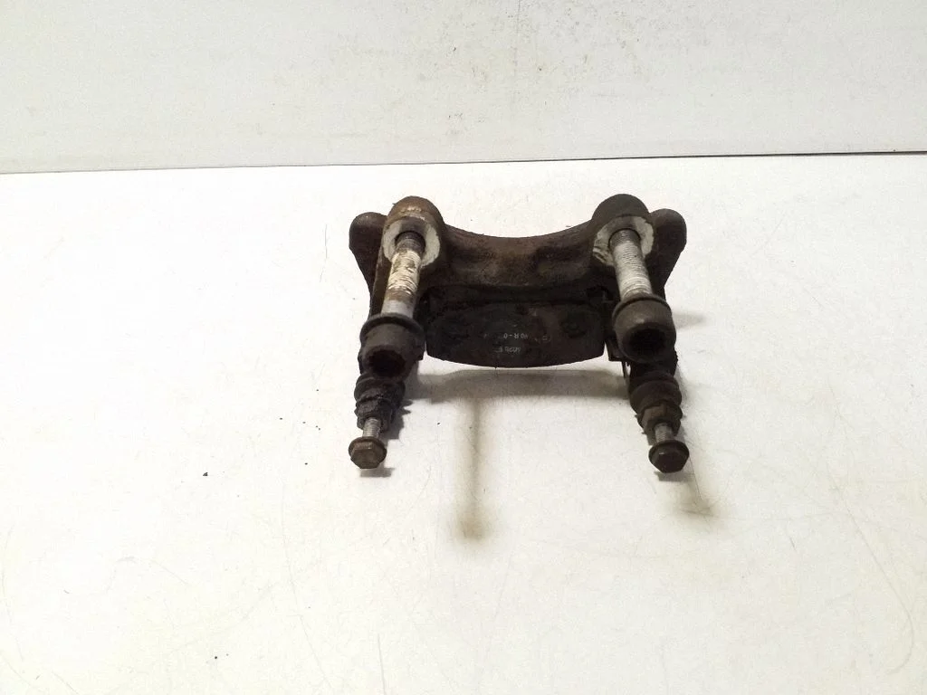 Piduriklotside hoidik/kandur (tagumine) – vasak