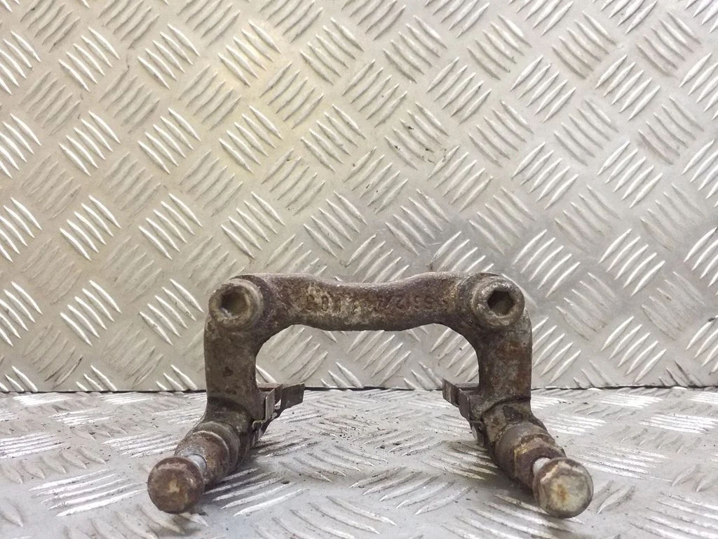 Bremžu klučiņu turētājs (aizmugurē)