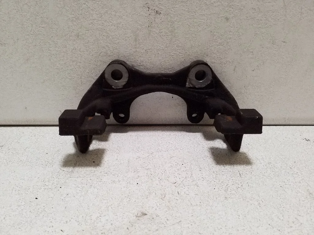 Brake caliper pad carrier rear – right