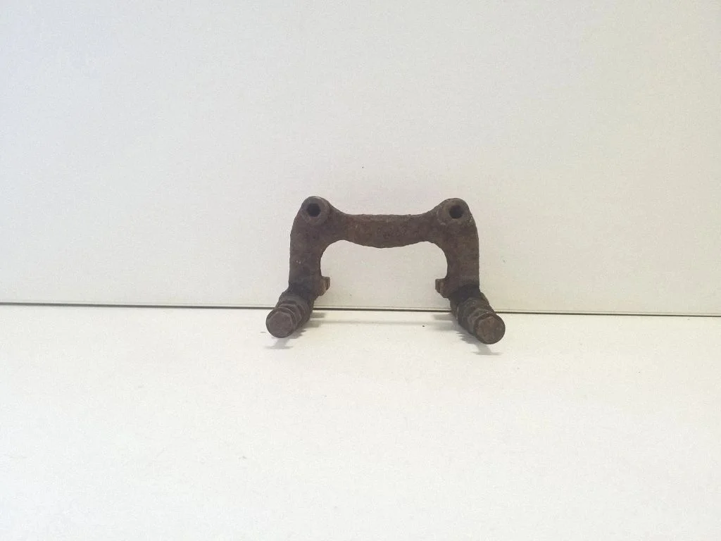 Brake caliper pad carrier rear