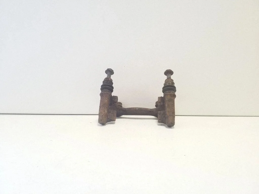 Brake caliper pad carrier rear