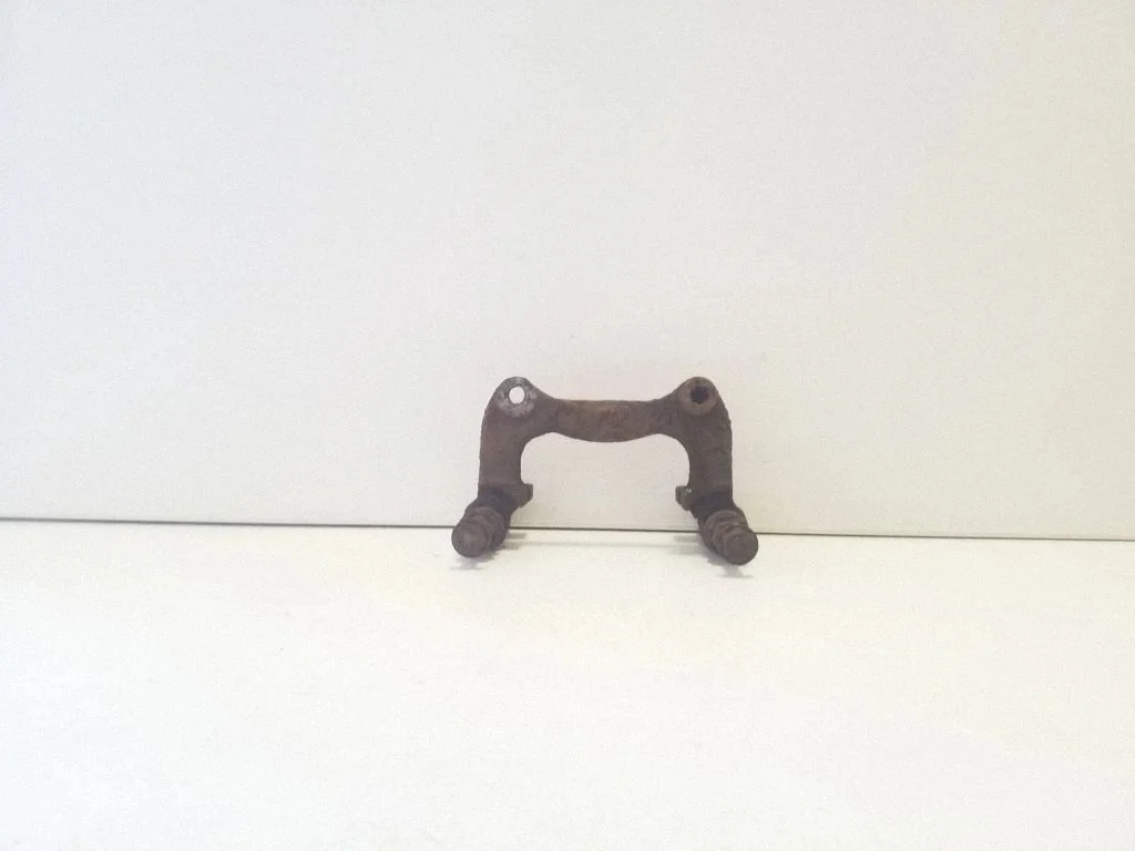 Brake caliper pad carrier rear