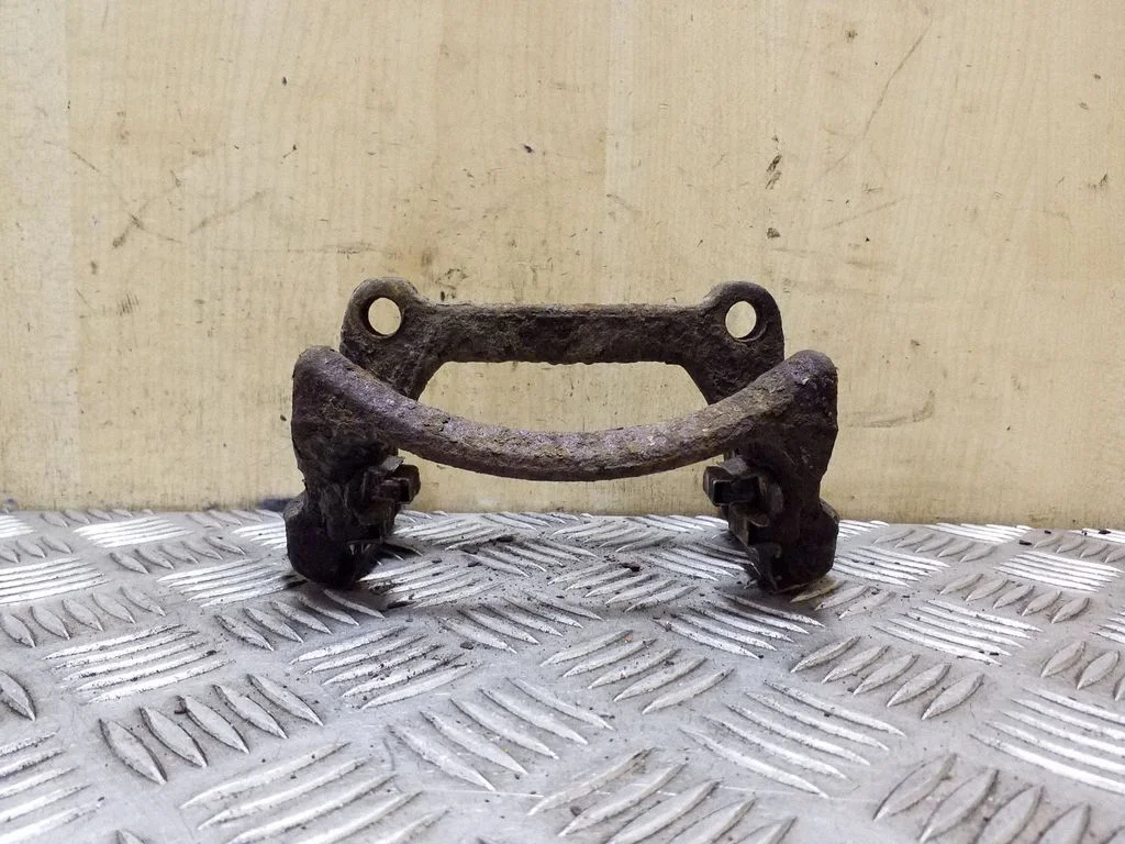 Brake caliper pad carrier rear