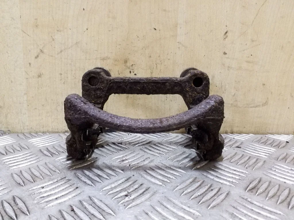 Brake caliper pad carrier rear