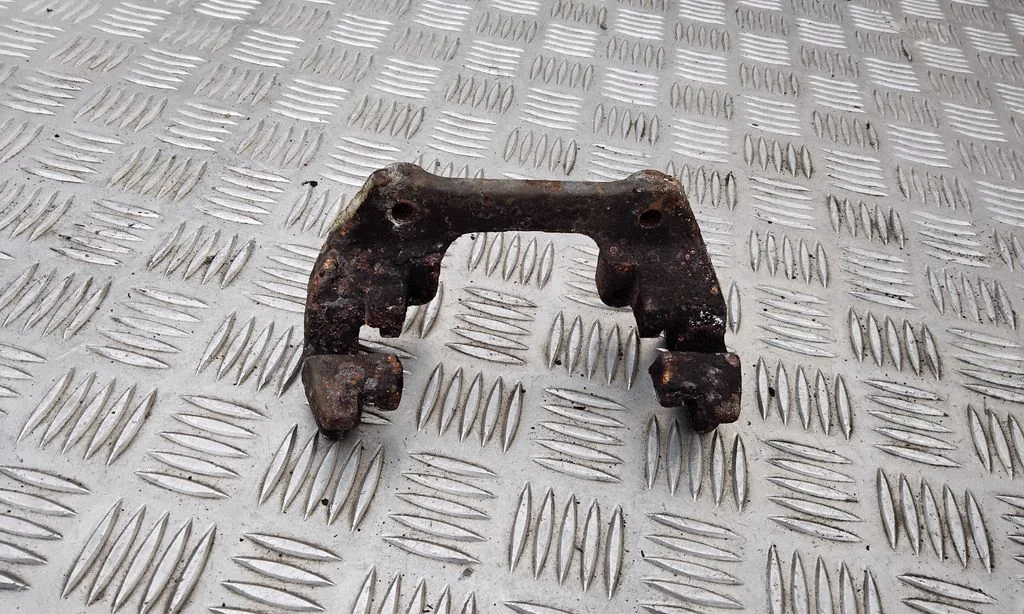 Brake caliper pad carrier rear